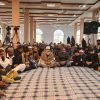 Congregation in prayer at BKM Community, Manchester