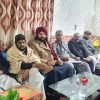 Guests seated together at a formal community gathering