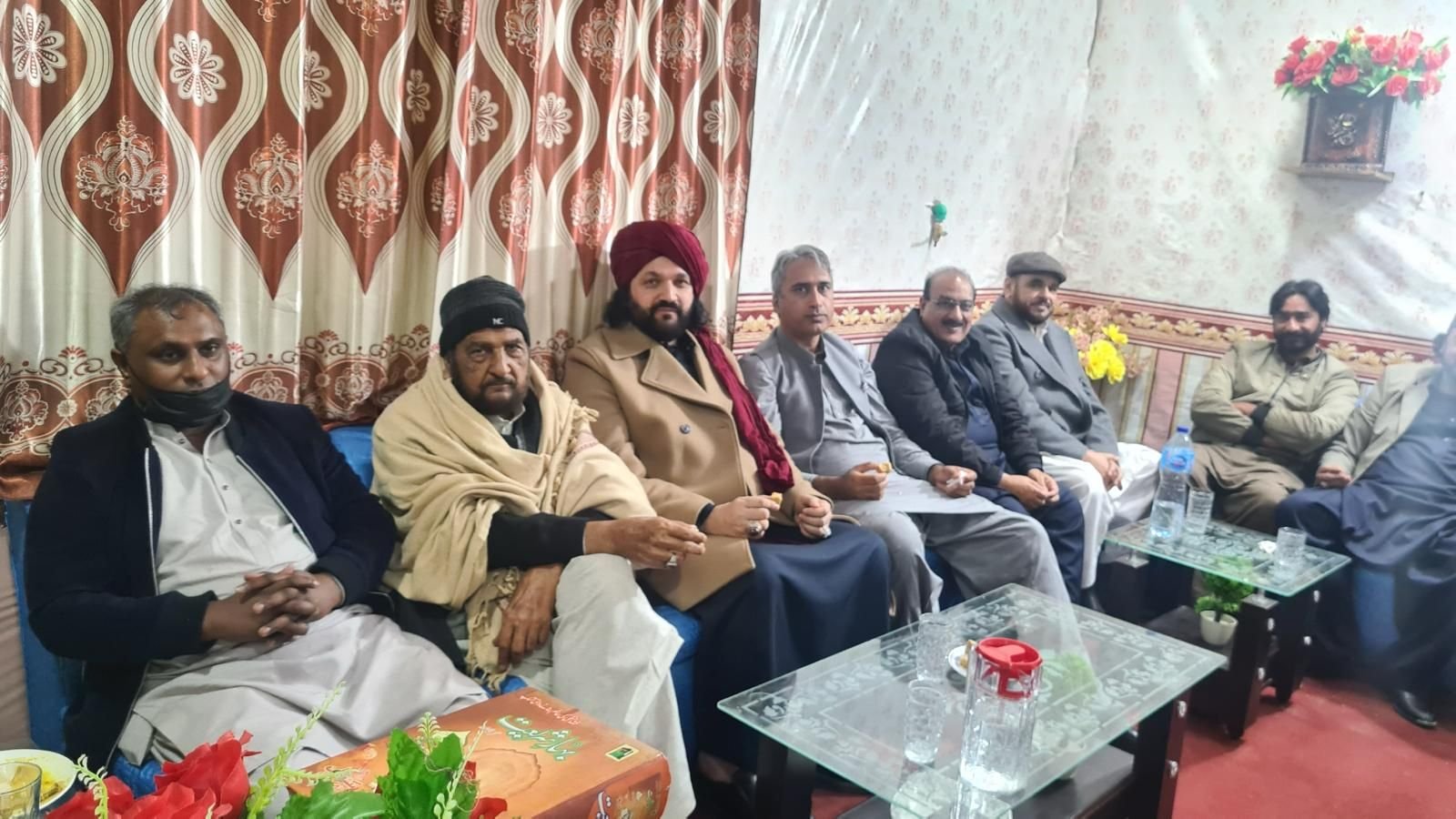 Guests seated together at a formal community gathering