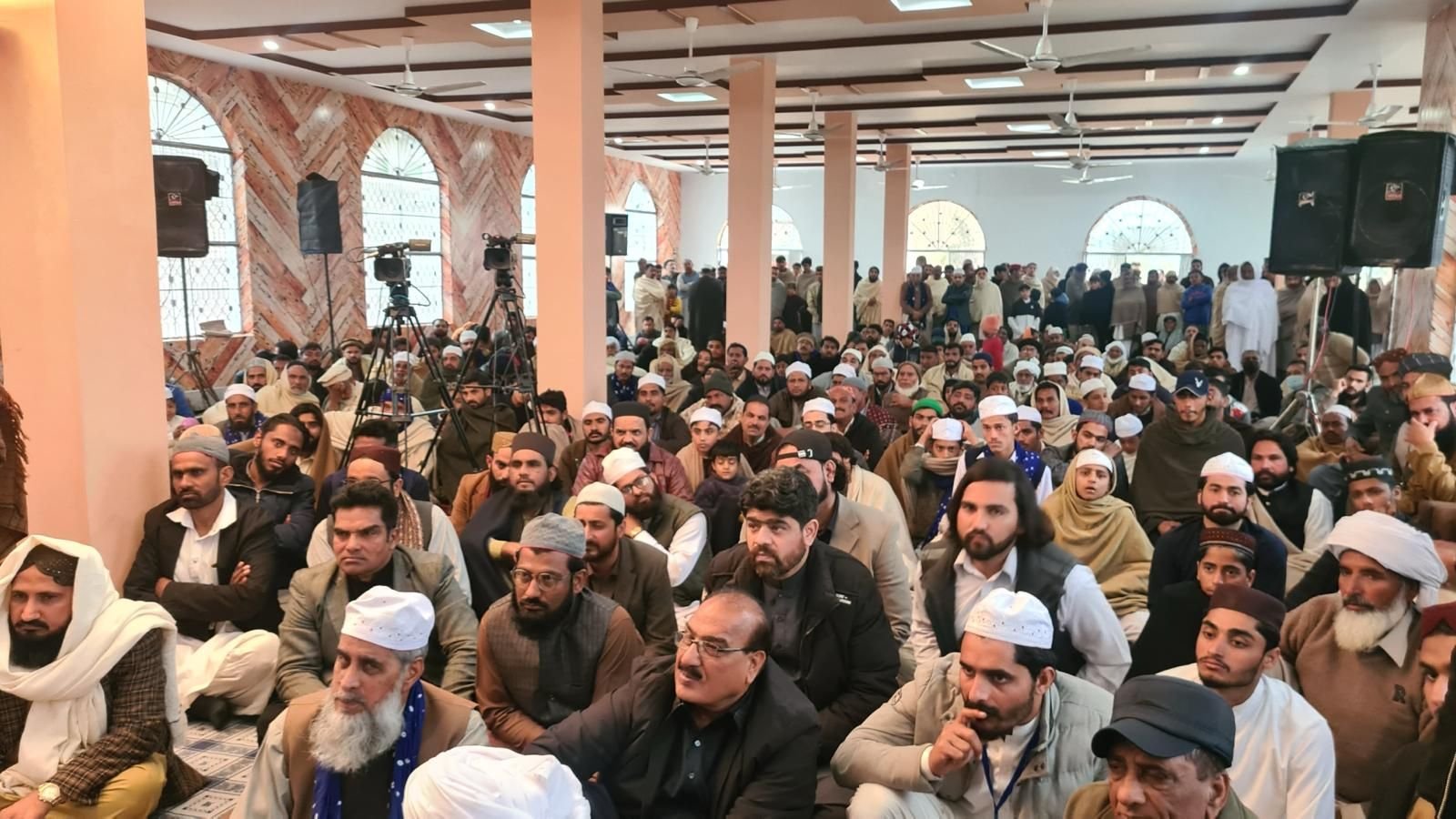 A large congregation gathered for an Islamic lecture and dhikr assembly