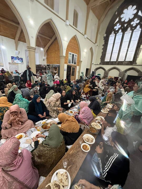 Community members gathered in the main hall