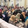 Community members gathered together for a shared meal
