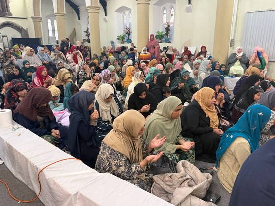 Community members gathered together for a shared meal